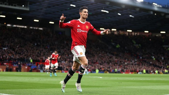 MANCHESTER, ENGLAND - MARCH 12: Cristiano Ronaldo of Manchester United celebrates after scoring their sides second goal during the Premier League match between Manchester United and Tottenham Hotspur at Old Trafford on March 12, 2022 in Manchester, England. (Photo by Naomi Baker/Getty Images)