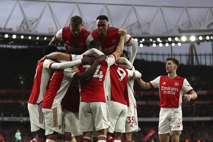 Arsenal's Alexandre Lacazette, celebrates with teammates after scoring his side's 2nd goal on a penalty kick during the English Premier League soccer match between Arsenal and Leicester City at the Emirates Stadium, in London, Sunday, March 13, 2022. (AP Photo/Ian Walton)