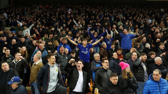 NORWICH, ENGLAND - MARCH 10: Chelsea fans celebrate after their sides victory during the Premier League match between Norwich City and Chelsea at Carrow Road on March 10, 2022 in Norwich, England. (Photo by Julian Finney/Getty Images)