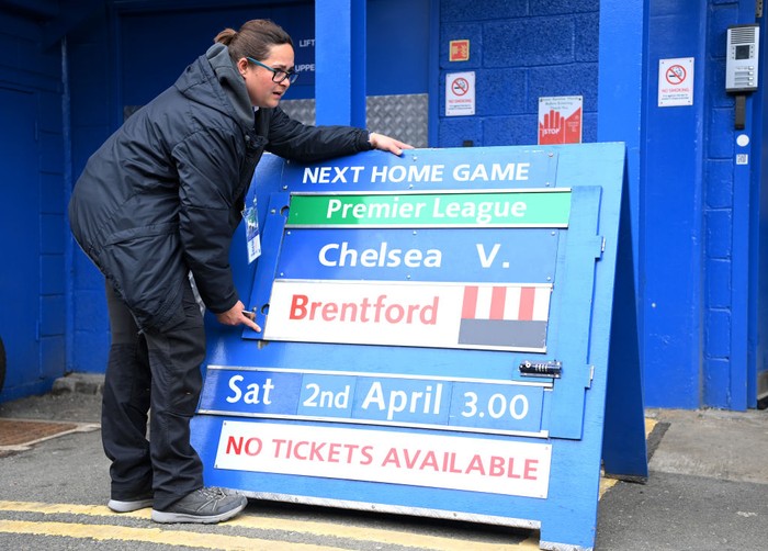 LONDON, ENGLAND - MARCH 13: A Chelsea FC worker is seen moving a board which reads 'No Tickets Available' prior to the Premier League match between Chelsea and Newcastle United at Stamford Bridge on March 13, 2022 in London, England. (Photo by Justin Setterfield/Getty Images)