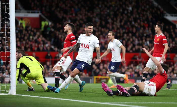MANCHESTER, ENGLAND - MARCH 12: Cristian Romero of Tottenham Hotspur reacts after an own goal by Harry Maguire of Manchester United for Tottenham Hotspur's second goal during the Premier League match between Manchester United and Tottenham Hotspur at Old Trafford on March 12, 2022 in Manchester, England. (Photo by Naomi Baker/Getty Images)