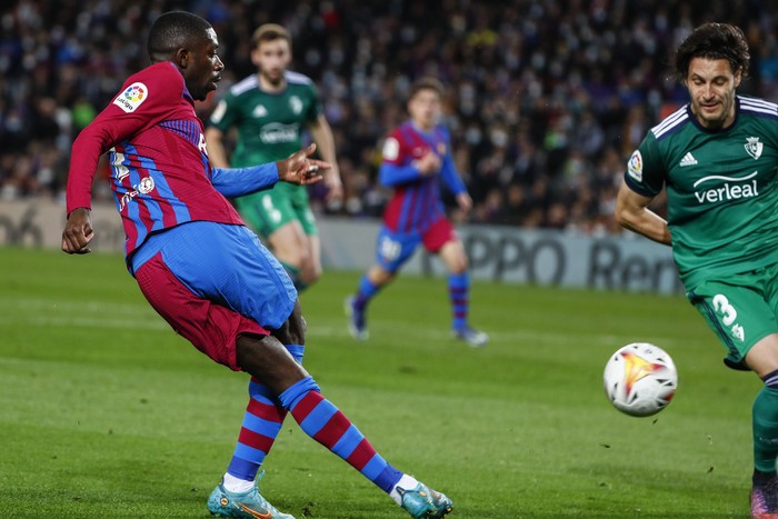 Barcelona's Ousmane Dembele kicks the ball during a Spanish La Liga soccer match between FC Barcelona and Osasuna at the Camp Nou stadium in Barcelona, Spain, Sunday, March 13, 2022. (AP Photo/Joan Monfort)