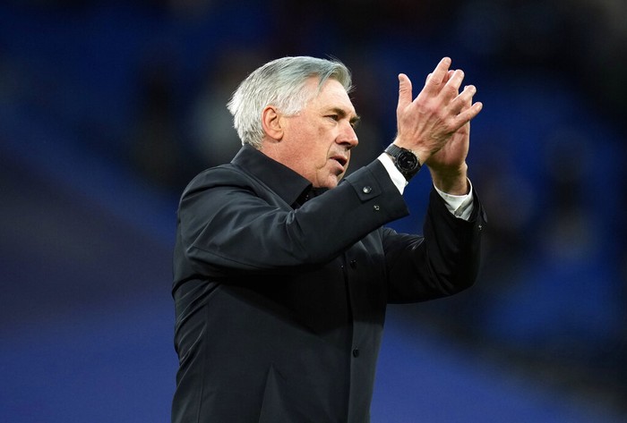 Real Madrids head coach Carlo Ancelotti, right, and Ferland Mendy celebrate after the Spanish La Liga soccer match between Real Madrid and Real Sociedad at the Bernabeu stadium in Madrid, Spain, Saturday, March 5, 2022. Real Madrid won the match 4-1. (AP Photo/Manu Fernandez)