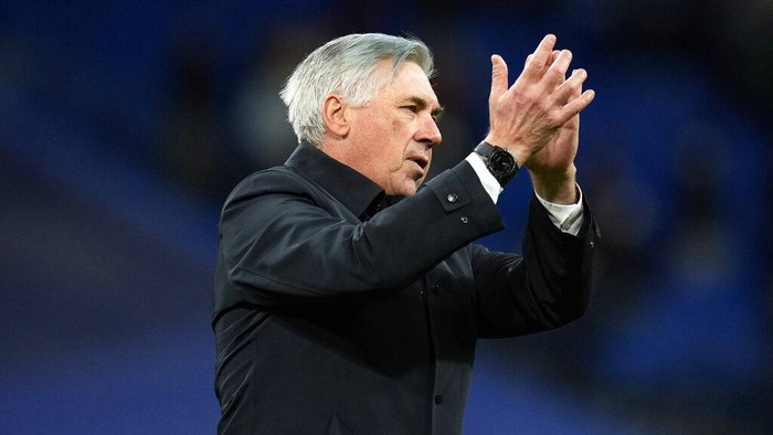 Real Madrids head coach Carlo Ancelotti, right, and Ferland Mendy celebrate after the Spanish La Liga soccer match between Real Madrid and Real Sociedad at the Bernabeu stadium in Madrid, Spain, Saturday, March 5, 2022. Real Madrid won the match 4-1. (AP Photo/Manu Fernandez)