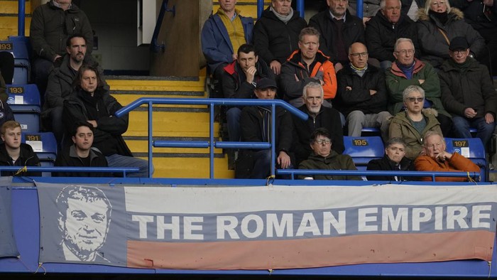A banner in the colors of Russias national flag depicting Chelsea soccer club owner Roman Abramovich and reading 