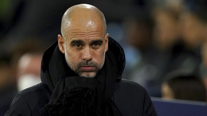 Manchester Citys head coach Pep Guardiola looks on before the Champions League round of 16 second leg soccer match between Manchester City and Sporting Lisbon at the City of Manchester Stadium in Manchester, England, Wednesday, March 9, 2022. (AP Photo/Dave Thompson)