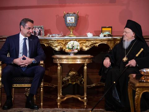 Ecumenical Patriarch of Constantinople Bartholomew I (R) meets with the Greek Prime Minister Kyriakos Mitsotakis (L) at the Greek Consulate in Istanbul on March 13, 2022. (Photo by Yasin AKGUL / AFP)