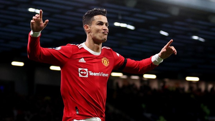 MANCHESTER, ENGLAND - MARCH 12: Cristiano Ronaldo of Manchester United celebrates after scoring their teams second goal during the Premier League match between Manchester United and Tottenham Hotspur at Old Trafford on March 12, 2022 in Manchester, England. (Photo by Naomi Baker/Getty Images)