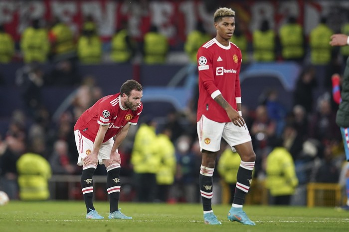 Manchester United Manchester United's Juan Mata, left, and teammate Marcus Rashford react following the Champions League round of 16, second leg soccer match between Manchester United and Atletico Madrid at Old Trafford, Manchester, England, Tuesday, March 15, 2022. (AP Photo/Dave Thompson)