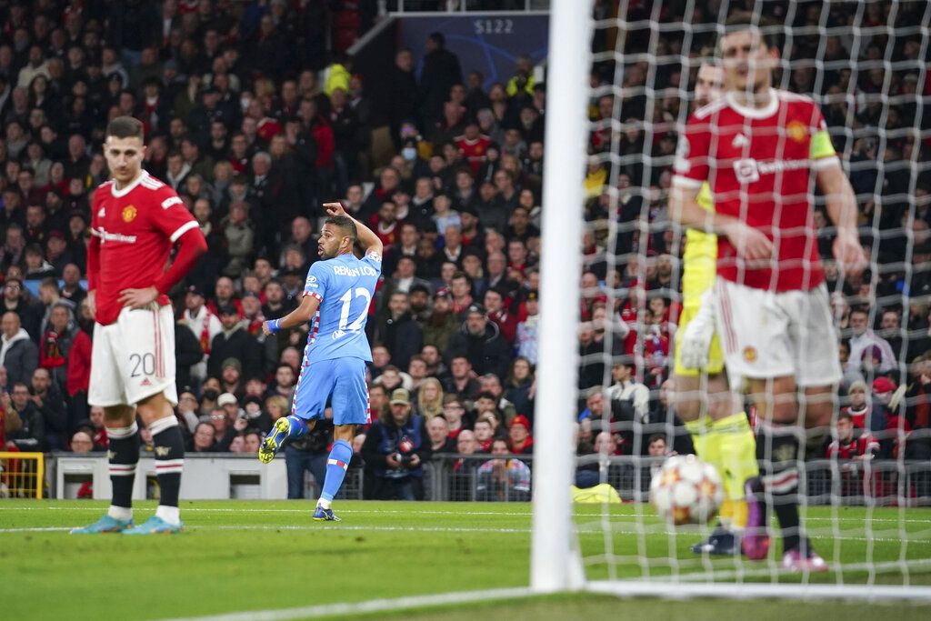 Atletico Madrid's Renan Lodi celebrates after scoring his team's first goal during the Champions League round of 16, second leg soccer match between Manchester United and Atletico Madrid at Old Trafford, Manchester, England, Tuesday, March 15, 2022. (AP Photo/Dave Thompson)