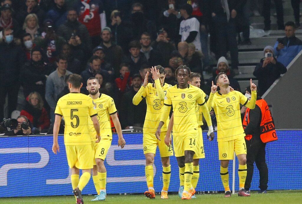 Lille's Burak Yilmaz scores a penalty, the opening goal of his team during the Champions League, second leg, round of 16, soccer match between Lille and Chelsea at the Stade Pierre Mauroy stadium in Villeneuve d'Ascq, northern France, Wednesday, March 16, 2022. (AP Photo/Michel Spingler)