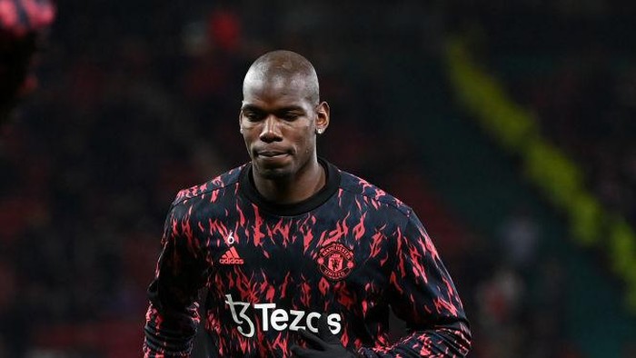 MANCHESTER, ENGLAND - MARCH 15: Paul Pogba of Manchester United warms up prior to the UEFA Champions League Round Of Sixteen Leg Two match between Manchester United and Atletico Madrid at Old Trafford on March 15, 2022 in Manchester, England. (Photo by Shaun Botterill/Getty Images)