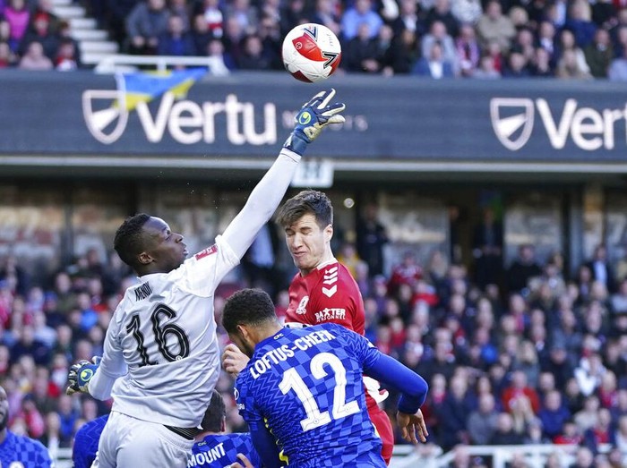 Chelsea's goalkeeper Edouard Mendy saves ball during the English FA Cup quarter final soccer match between Middlesbrough and Chelsea at the Riverside Stadium, in Middlesbrough, England, Saturday March 19, 2022. (AP Photo/Jon Super)