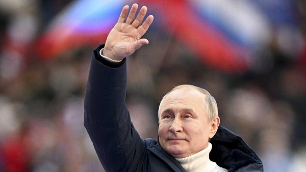 Russian President Vladimir Putin greets people after his speech at the concert marking the eighth anniversary of the referendum on the state status of Crimea and Sevastopol and its reunification with Russia, in Moscow, Russia, Friday, March 18, 2022. (Ramil Sitdikov/Sputnik Pool Photo via AP)