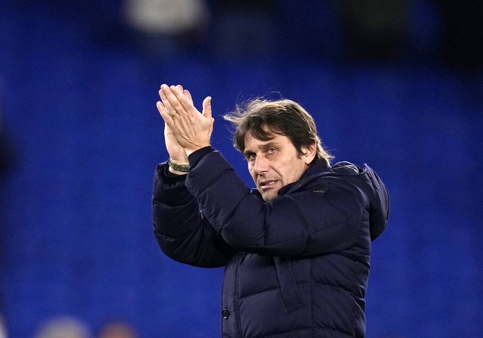 Tottenhams head coach Antonio Conte applauds to fans at the end of the English Premier League soccer match between Brighton and Tottenham Hotspur at the Falmer stadium in Brighton, England, Wednesday, March 16, 2022. (AP Photo/Matt Dunham)