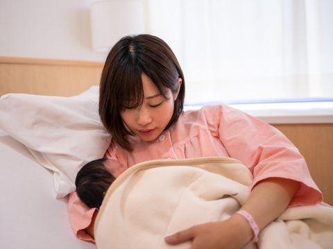 Illustration of breastfeeding after giving birth
