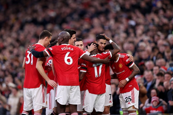 Manchester United MANCHESTER, ENGLAND - MARCH 12: Cristiano Ronaldo of Manchester United celebrates with his team after scoring their team's first goal during the Premier League match between Manchester United and Tottenham Hotspur at Old Trafford on March 12, 2022 in Manchester, England. (Photo by Naomi Baker/Getty Images)
