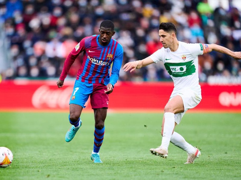 ELCHE, SPAIN - MARCH 06: Ousmane Dembele of FC Barcelona duels for the ball with Fidel Chaves of Elche CF during the LaLiga Santander match between Elche CF and FC Barcelona at Estadio Manuel Martinez Valero on March 06, 2022 in Elche, Spain. (Photo by Aitor Alcalde/Getty Images)