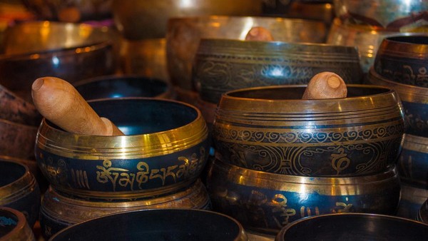 brass bowls decorated with wooden mortar