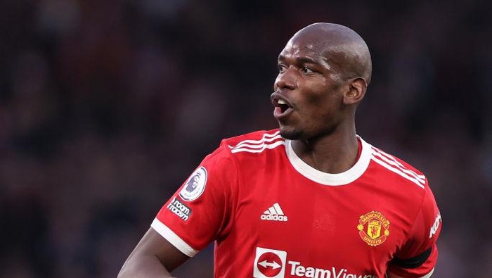 MANCHESTER, ENGLAND - MARCH 12: Paul Pogba of Manchester United in action during the Premier League match between Manchester United and Tottenham Hotspur at Old Trafford on March 12, 2022 in Manchester, England. (Photo by Naomi Baker/Getty Images)