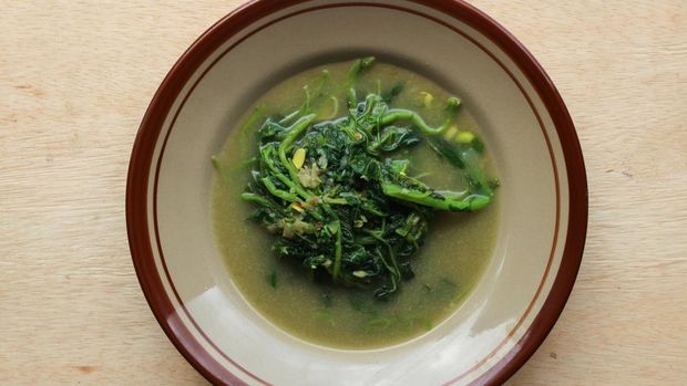 Sayur Bobor Bayam or Spinach coconut milk soup is made from spinach. Indonesian homemade food