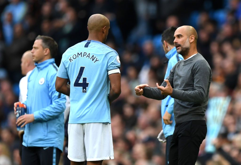 LONDON, ENGLAND - FEBRUARY 24:  Vincent Kompany of Manchester City is congratulated by Josep Guardiola, Manager of Manchester City following the Carabao Cup Final between Chelsea and Manchester City at Wembley Stadium on February 24, 2019 in London, England.  (Photo by Clive Rose/Getty Images)