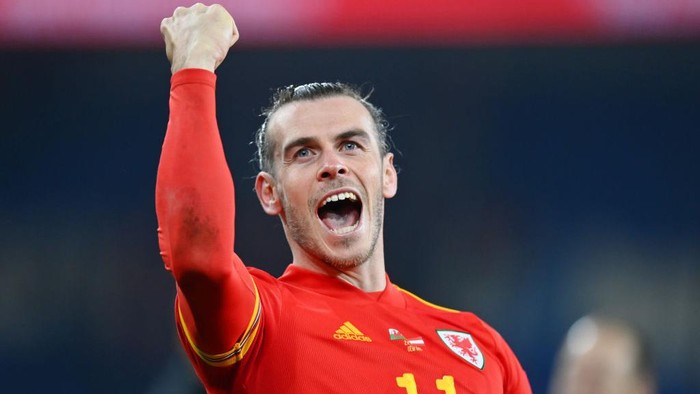CARDIFF, WALES - MARCH 24: Gareth Bale of Wales celebrates following their sides victory in the 2022 FIFA World Cup Qualifier knockout round play-off match between Wales and Austria at Cardiff City Stadium on March 24, 2022 in Cardiff, Wales. (Photo by Dan Mullan/Getty Images)