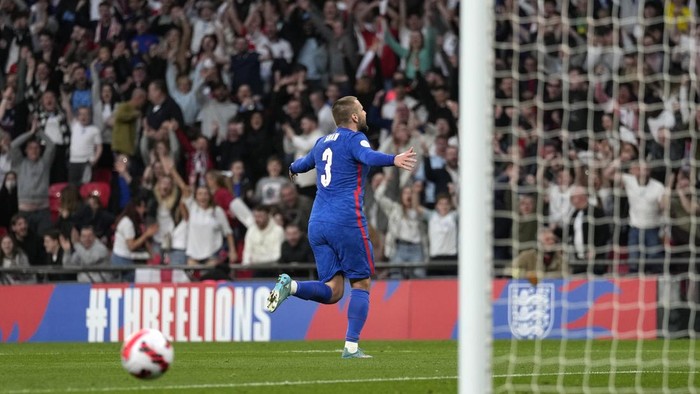 Englands Luke Shaw celebrates after scoring his sides first goal during an international soccer match between England and Switzerland at Wembley Stadium in London, Saturday, March 26, 2022. (AP Photo/Alastair Grant)