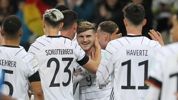 Germanys forward Timo Werner (C) celebrates scoring his teams s 2:0 with his team mates during the friendly football match Germany vs Israel in Sinsheim, Germany, on March 26, 2022. (Photo by Daniel ROLAND / AFP)