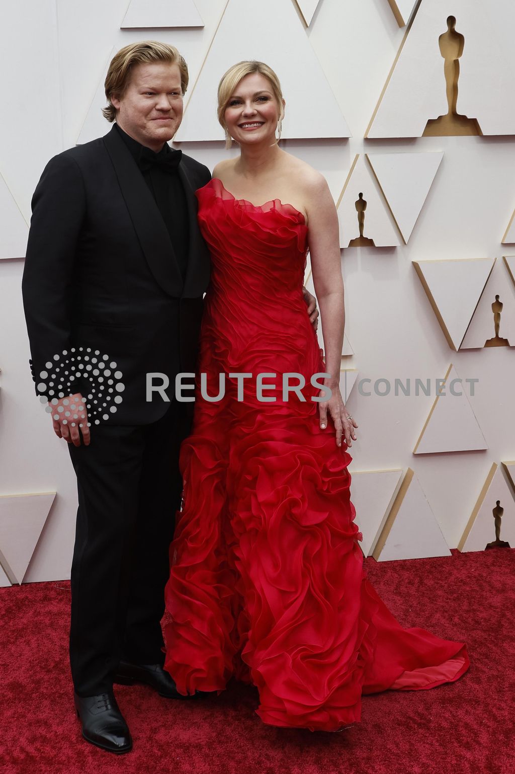 Kirsten Dunst and husband Jesse Plemons pose on the red carpet during the Oscars arrivals at the 94th Academy Awards in Hollywood, Los Angeles, California, U.S., March 27, 2022. REUTERS/Eric Gaillard