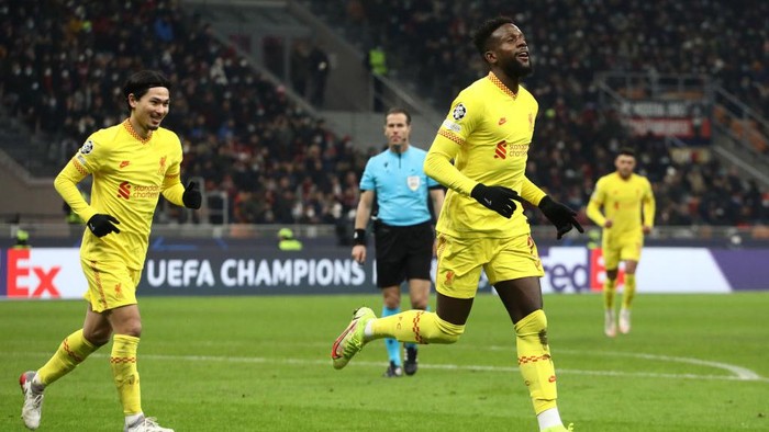 MILAN, ITALY - DECEMBER 07: Divock Origi of Liverpool celebrates after scoring their sides second goal during the UEFA Champions League group B match between AC Milan and Liverpool FC at Giuseppe Meazza Stadium on December 07, 2021 in Milan, Italy. (Photo by Marco Luzzani/Getty Images)