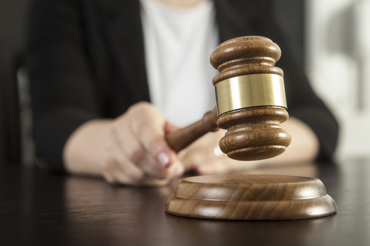 Caucasian woman holding gavel