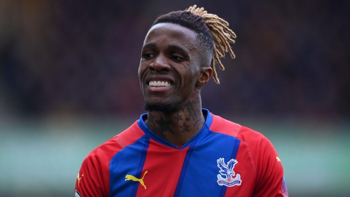 WOLVERHAMPTON, ENGLAND - MARCH 05: Wilfried Zaha of Crystal Palace looks on during the Premier League match between Wolverhampton Wanderers and Crystal Palace at Molineux on March 05, 2022 in Wolverhampton, England. (Photo by Laurence Griffiths/Getty Images)
