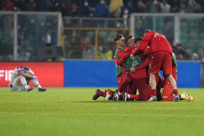 Gianluigi Donnarumma North Macedonia players celebrate at the end of the World Cup qualifying play-off soccer match between Italy and North Macedonia, at Renzo Barbera stadium, in Palermo, Italy, Thursday, March 24, 2022. North Macedonia won 1-0. (AP Photo/Antonio Calanni)