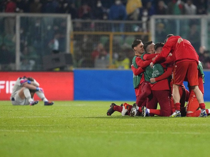 North Macedonia players celebrate at the end of the World Cup qualifying play-off soccer match between Italy and North Macedonia, at Renzo Barbera stadium, in Palermo, Italy, Thursday, March 24, 2022. North Macedonia won 1-0. (AP Photo/Antonio Calanni)