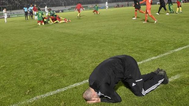 Algeria's coach Djamel Belmadi reacts to their defeat during the second leg of the 2022 Qatar World Cup African Qualifiers football match between Algeria and Cameroon at the Mustapha Tchaker Stadium in the city of Blida on March 29, 2022. - Karl Toko Ekambi scored in the fourth minute of added time at the end of extra time to gave Cameroon a dramatic 2-1 win over Algeria in Blida and a place at the 2022 World Cup. (Photo by RYAD KRAMDI / AFP)