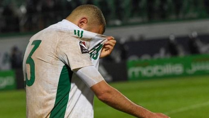 Algerias coach Djamel Belmadi reacts to their defeat during the second leg of the 2022 Qatar World Cup African Qualifiers football match between Algeria and Cameroon at the Mustapha Tchaker Stadium in the city of Blida on March 29, 2022. - Karl Toko Ekambi scored in the fourth minute of added time at the end of extra time to gave Cameroon a dramatic 2-1 win over Algeria in Blida and a place at the 2022 World Cup. (Photo by RYAD KRAMDI / AFP)