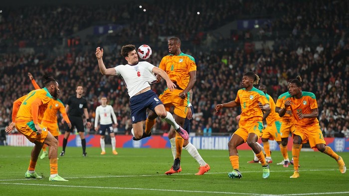 LONDON, ENGLAND - MARCH 29: Harry Maguire of England and Willy Boly of Cote DIvoire battle for possession during the international friendly match between England and Cote DIvoire at Wembley Stadium on March 29, 2022 in London, England. (Photo by Catherine Ivill/Getty Images)