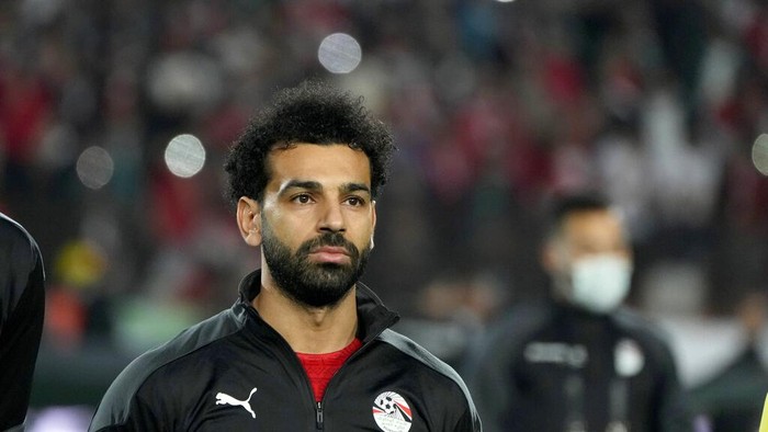 Egypts Mohamed Salah listens to the national anthem during a qualifying soccer match against Senegal for the FIFA World Cup Qatar 2022 at Cairo International stadium in Cairo, Egypt, Friday, March 25, 2022. (AP Photo/Amr Nabil)