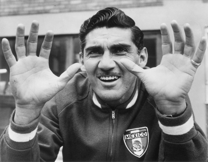 July 1966:  Antonio Carbajal, the Mexican goalkeeper, showing his injured left hand during a training session in Hertfordshire.  (Photo by Hulton Archive/Getty Images)