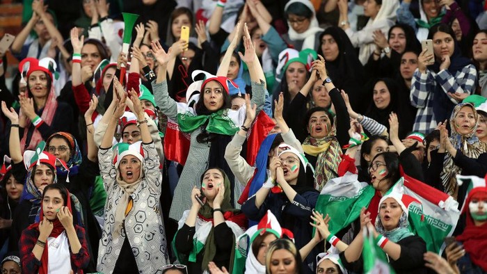 TEHRAN, IRAN - OCTOBER 10: Female football fans show their support during of the FIFA World Cup Qualifier match between Iran and Cambodia at Azadi Stadium on October 10, 2019 in Tehran, Iran. (Photo by Amin M. Jamali/Getty Images)