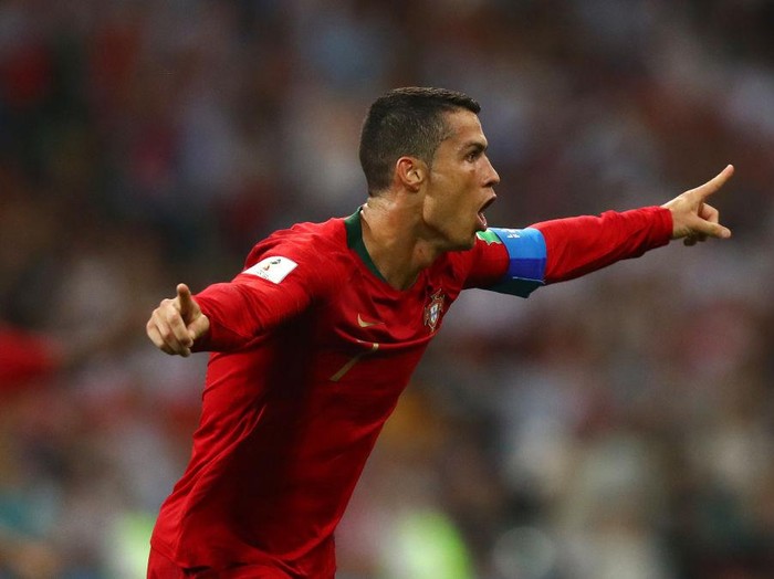 FRANKFURT, GERMANY - JUNE 17: Cristiano Ronaldo of Portugal hurdles the challenge of Mohammad Nosrati of Iran during the FIFA World Cup Germany 2006 Group D match between Portugal and Iran played at the Stadium Frankfurt on June 17, 2006 in Frankfurt, Germany. (Photo by Clive Mason/Getty Images)