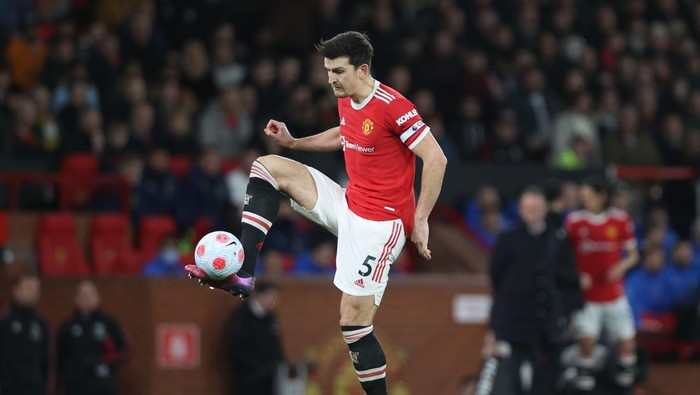 MANCHESTER, ENGLAND - MARCH 12: Harry Maguire of Manchester United controls the ball during the Premier League match between Manchester United and Tottenham Hotspur at Old Trafford on March 12, 2022 in Manchester, England. (Photo by Naomi Baker/Getty Images)