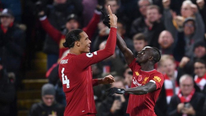 LIVERPOOL, ENGLAND - NOVEMBER 10: Sadio Mane of Liverpool celebrates after scoring his teams third goal with teammate Virgil van Dijk during the Premier League match between Liverpool FC and Manchester City at Anfield on November 10, 2019 in Liverpool, United Kingdom. (Photo by Laurence Griffiths/Getty Images)