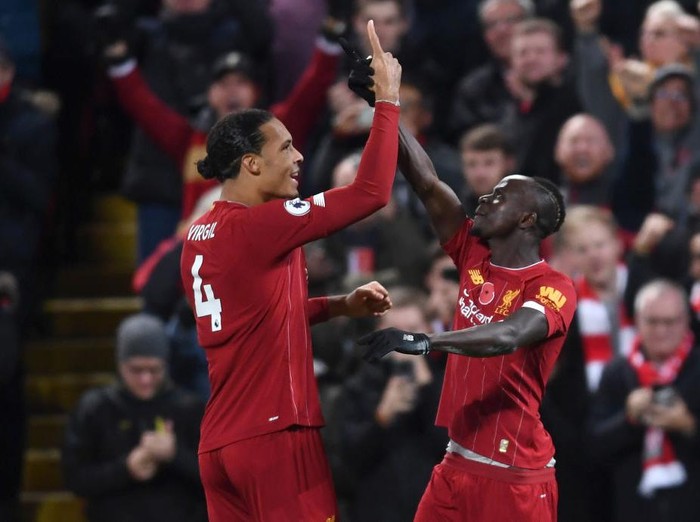 LIVERPOOL, ENGLAND - NOVEMBER 10: Sadio Mane of Liverpool celebrates after scoring his teams third goal with teammate Virgil van Dijk during the Premier League match between Liverpool FC and Manchester City at Anfield on November 10, 2019 in Liverpool, United Kingdom. (Photo by Laurence Griffiths/Getty Images)