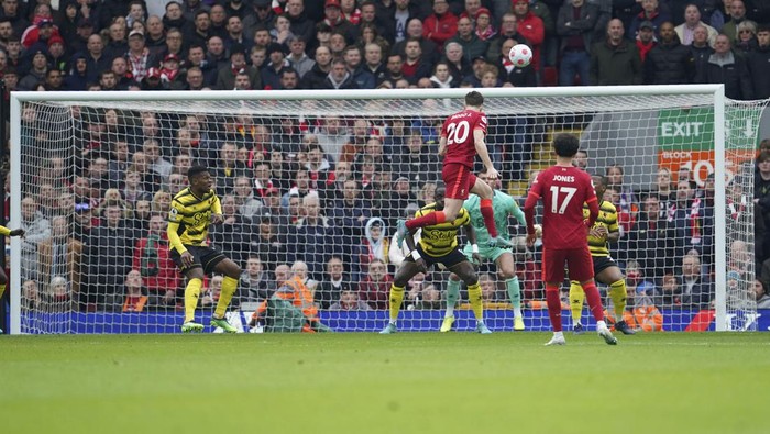 Liverpools Diogo Jota, top, attempts a goal during the English Premier League soccer match between Liverpool and Watford at Anfield stadium in Liverpool, England, Saturday, April 2, 2022. (AP Photo/Jon Super)