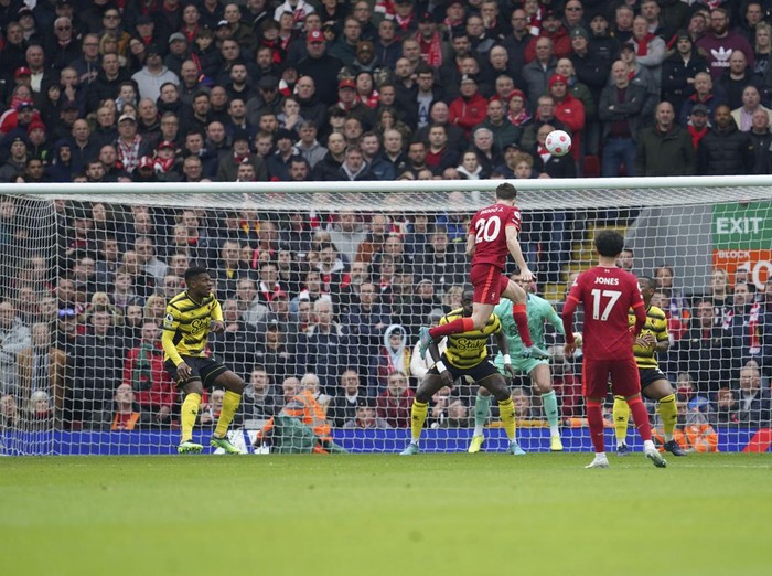 Liverpool's Diogo Jota, top, attempts a goal during the English Premier League soccer match between Liverpool and Watford at Anfield stadium in Liverpool, England, Saturday, April 2, 2022. (AP Photo/Jon Super)