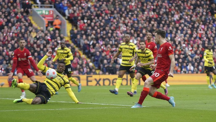 Liverpools Diogo Jota, right, attempts a goal during the English Premier League soccer match between Liverpool and Watford at Anfield stadium in Liverpool, England, Saturday, April 2, 2022. (AP Photo/Jon Super)