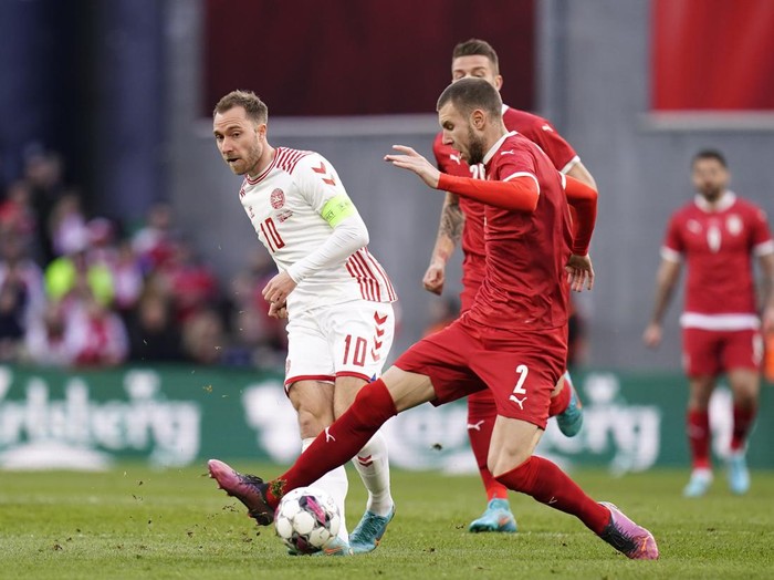 Denmark's Christian Eriksen, left, and Serbia's Strahinja Pavlovic battle for the ball during the international friendly soccer match between Denmark and Serbia in the Park, Copenhagen, Tuesday March 29, 2022. (Liselotte Sabroe/Ritzau Scanpix via AP)