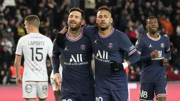 PSG's Lionel Messi, left, celebrates with his teammate Neymar after scoring his side's fourth goal during the French League One soccer match between Paris Saint Germain and FC Lorient at Parc des Princes stadium in Paris, Sunday, April 3, 2022. (AP Photo/Michel Euler)